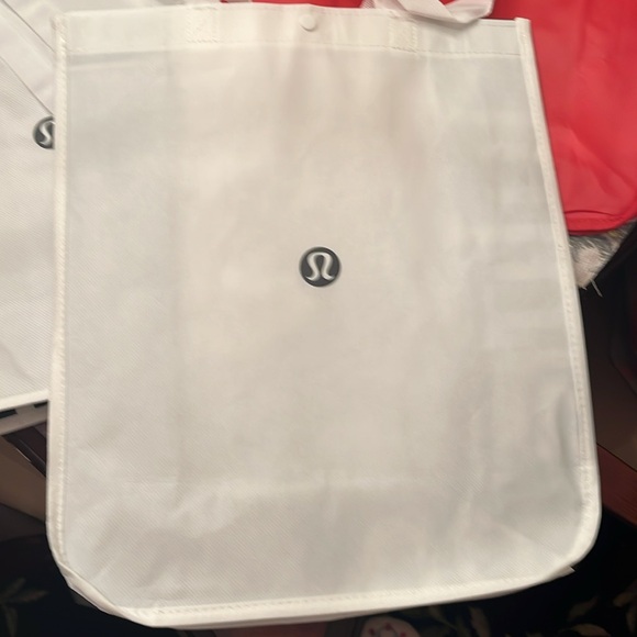 Three medium lululemon shopping bags. Great for packing gifts - Picture 2 of 3